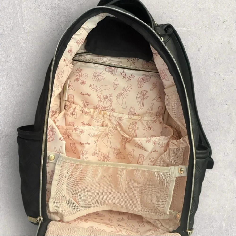 Itzy Ritzy Boss Plus black diaper bag backpack with gold hardware.